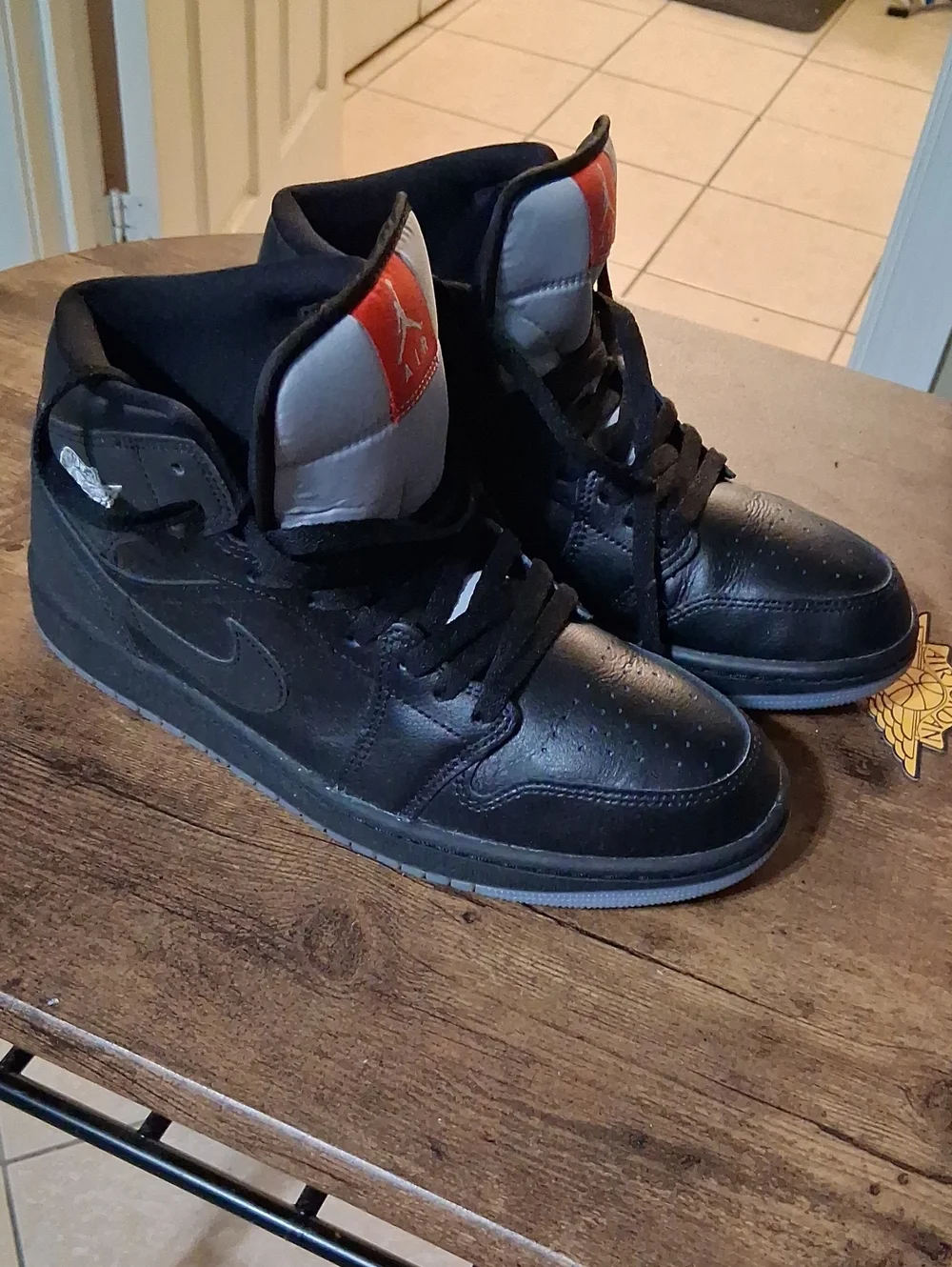 Jordan Black High-Top Sneakers with Red Tongue Patch